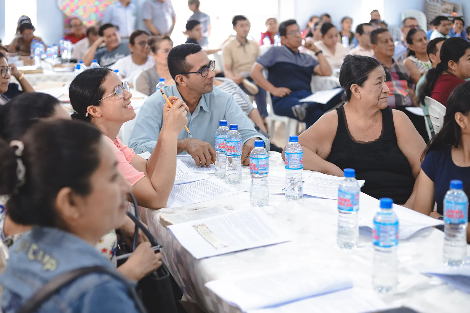 Pastors and church leaders listening attentively during a training gathering in Ecuador.